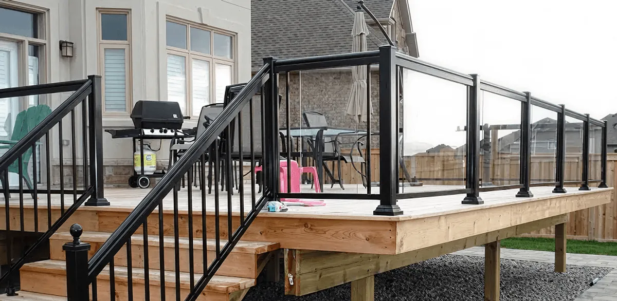 Handrail installation on a deck staircase for safety and code compliance in Akron, OH